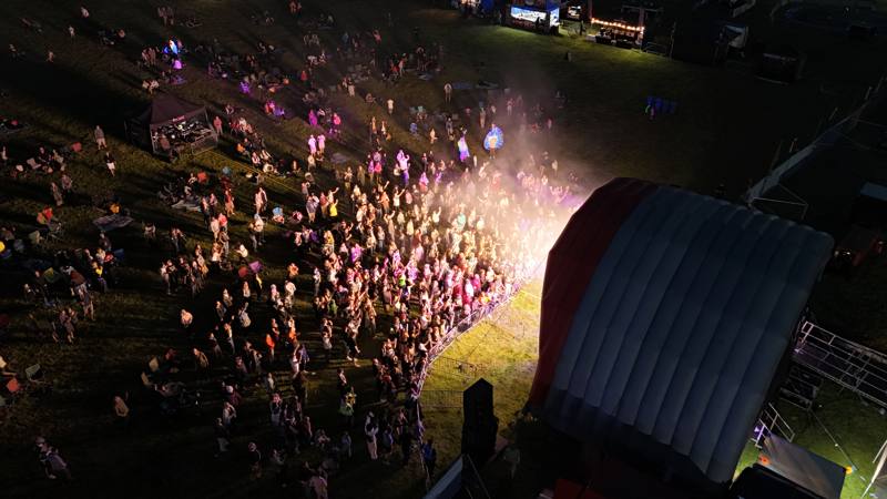Aerial view of a festival crowd in front of the main stage